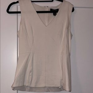 White sleeveless fitted blouse